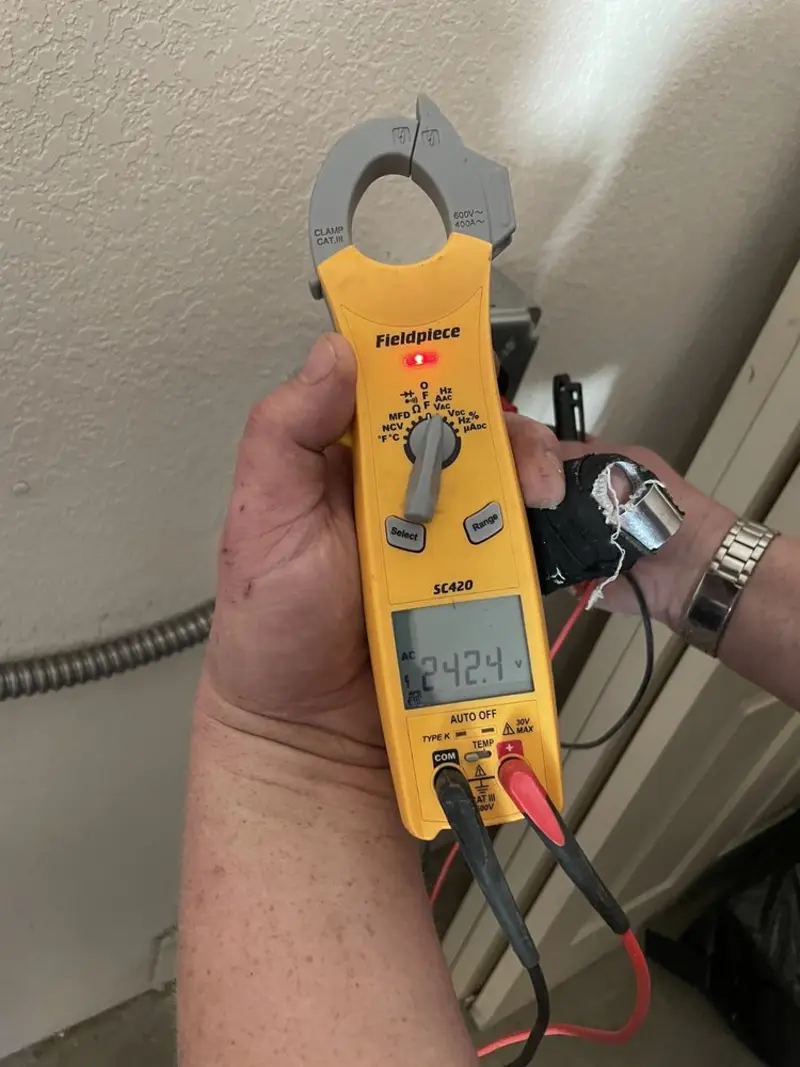 Voltage testing with clamp meter during Ceiling Fan Installation in Litchfield Beach